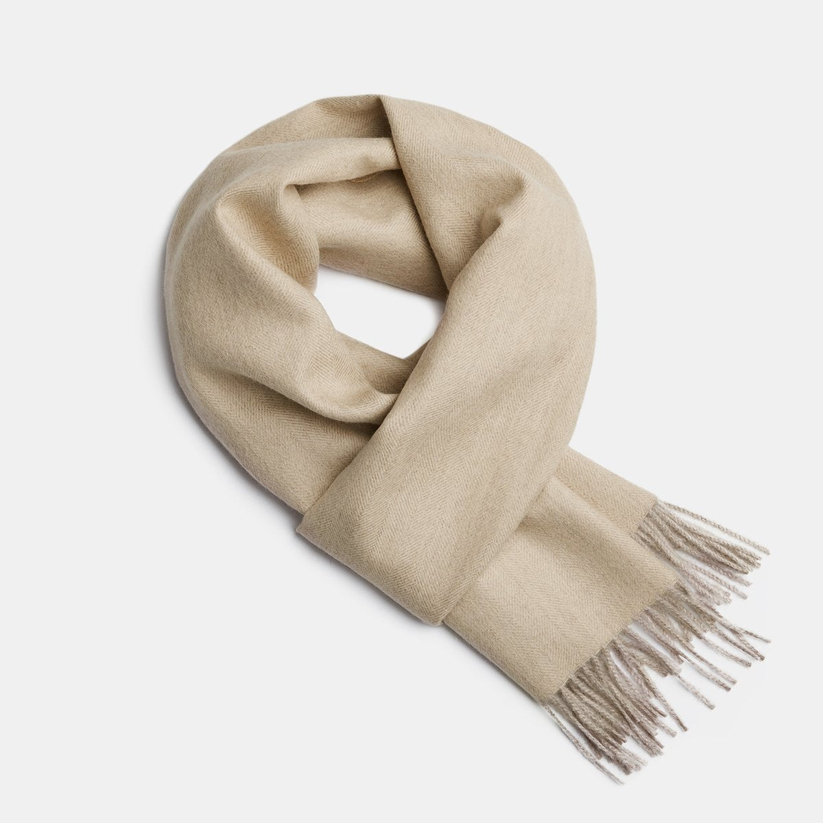 14. Studio image of Alpaka natural baby alpaca wool scarf in cream with fringe detail