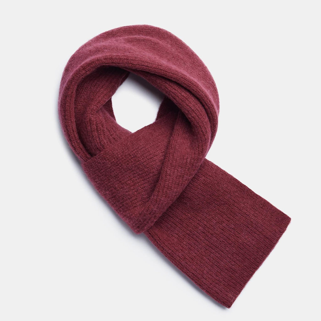 16. Flat lay of amber Alpaka Fisherman's Rib scarf showing texture and design