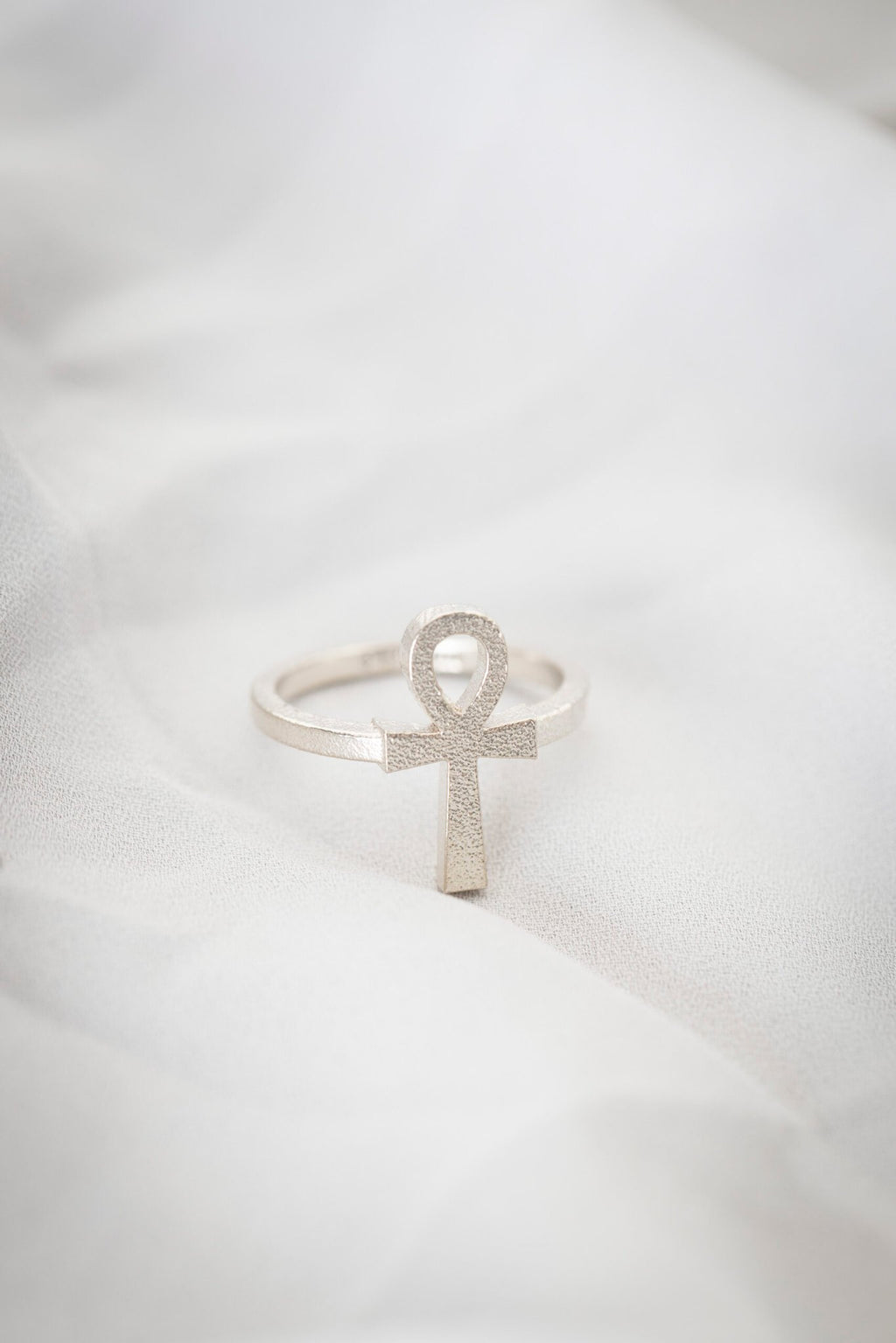 3. Close-up of New Vintage by Kriss Ankh Ring in 925 silver on soft fabric, emphasizing craftsmanship