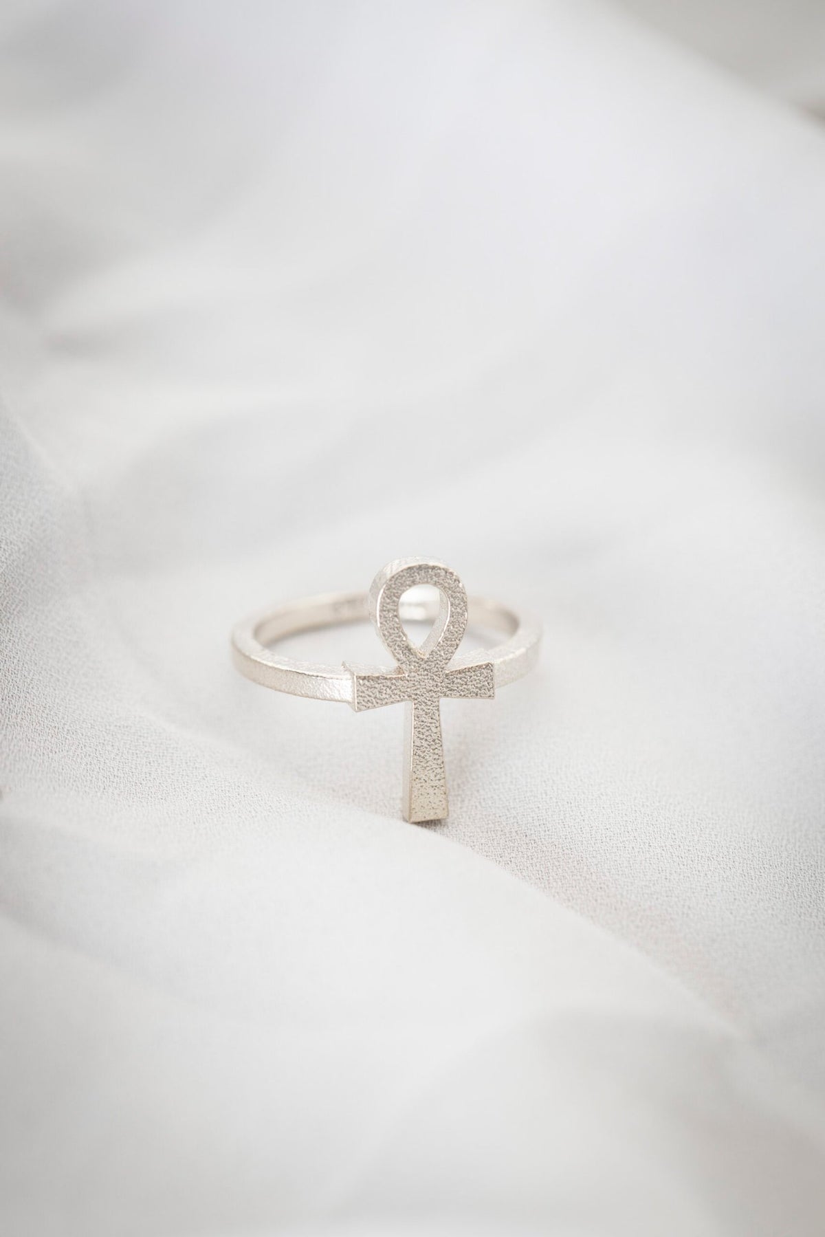 3. Close-up of New Vintage by Kriss Ankh Ring in 925 silver on soft fabric, emphasizing craftsmanship