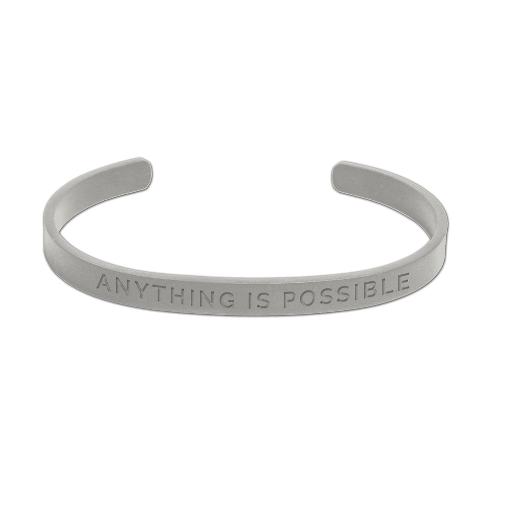 3. Men's silver Olla bracelet with 'Anything Is Possible' engraving, presented in studio