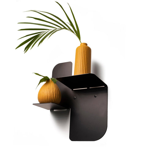 1. Black metal floating wall shelf with two yellow vases and green plant, side view
