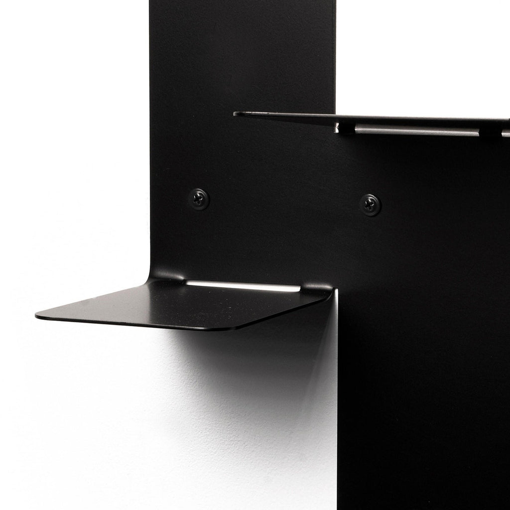 3. Close-up of black metal floating wall shelf showing mounting details