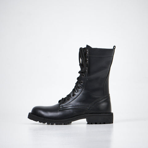 2. Aipi black leather boots with durable rubber sole, side profile in studio