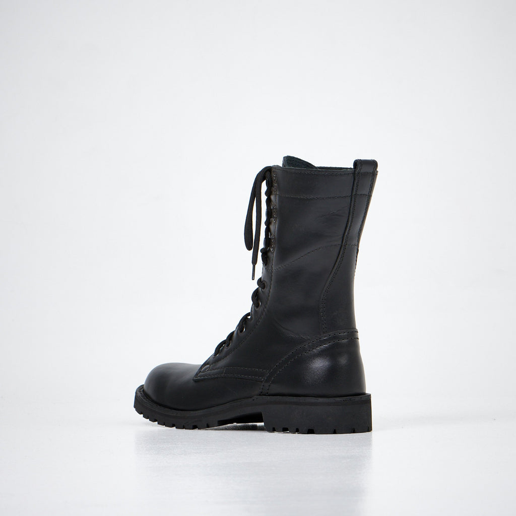 1. Aipi black handmade leather boots with lace-up closure, side view in studio setting