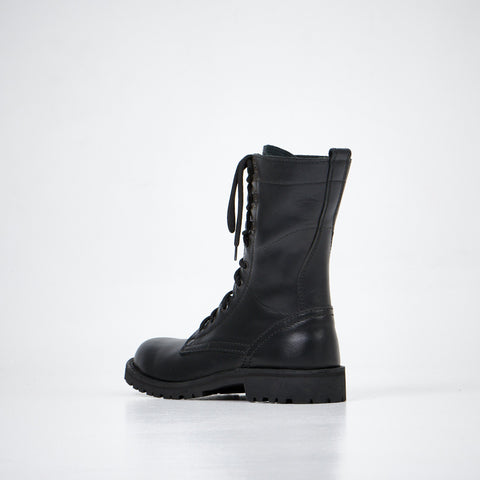 1. Aipi black handmade leather boots with lace-up closure, side view in studio setting