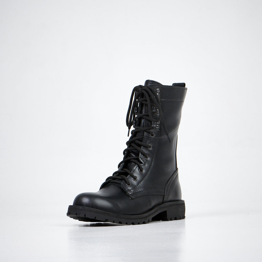 5. Aipi black handmade leather boots with stitched soles, angled front view in studio