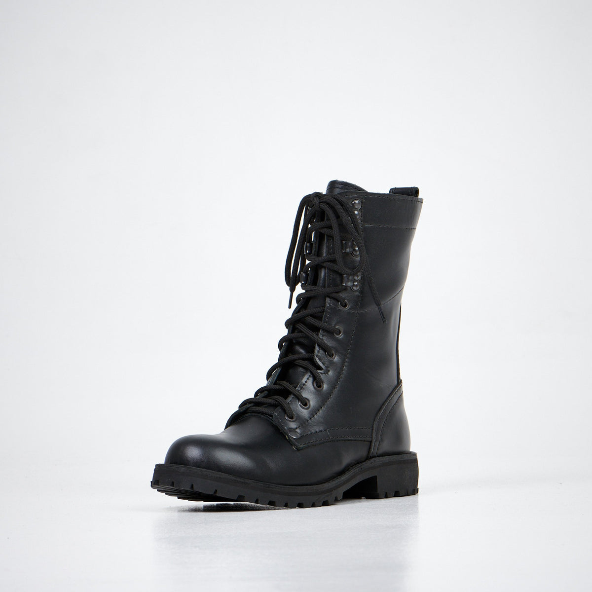 5. Aipi black handmade leather boots with stitched soles, angled front view in studio