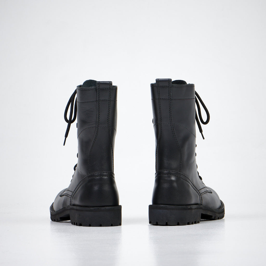 4. Rear view of Aipi black leather boots with lace-up design, studio shot