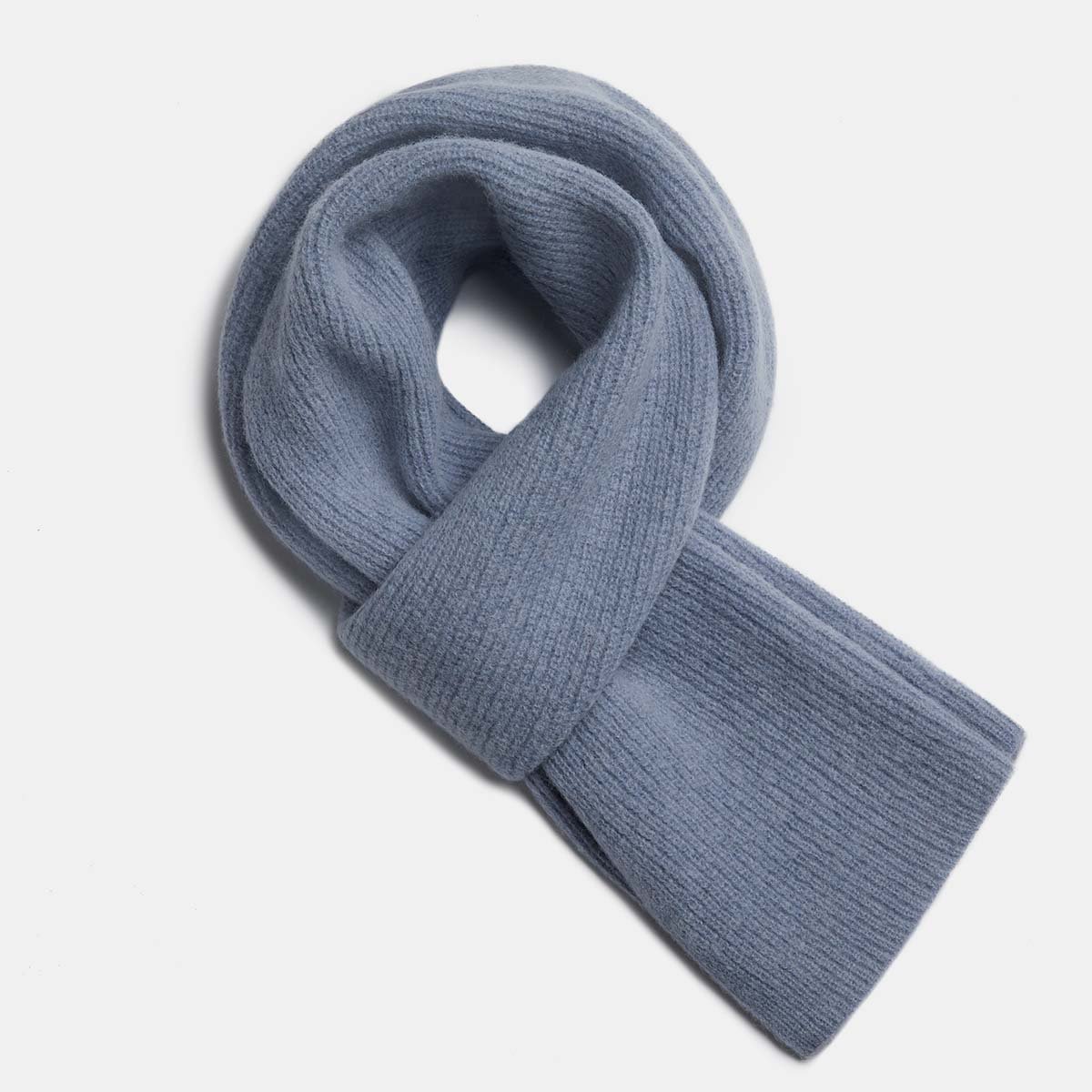 25. Flat lay of dusty blue Alpaka Fisherman's Rib scarf showing texture and design