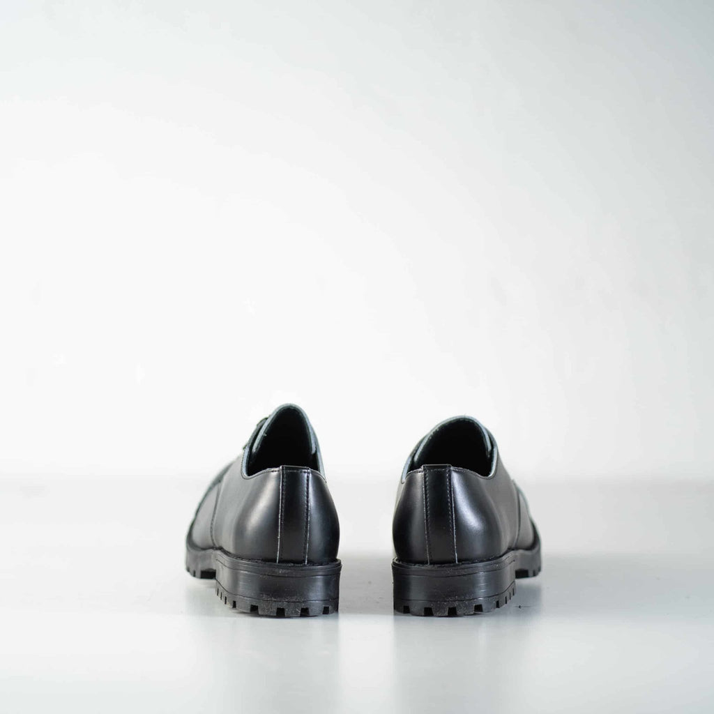 10. Studio image of unisex black Samelin Widgets, back view