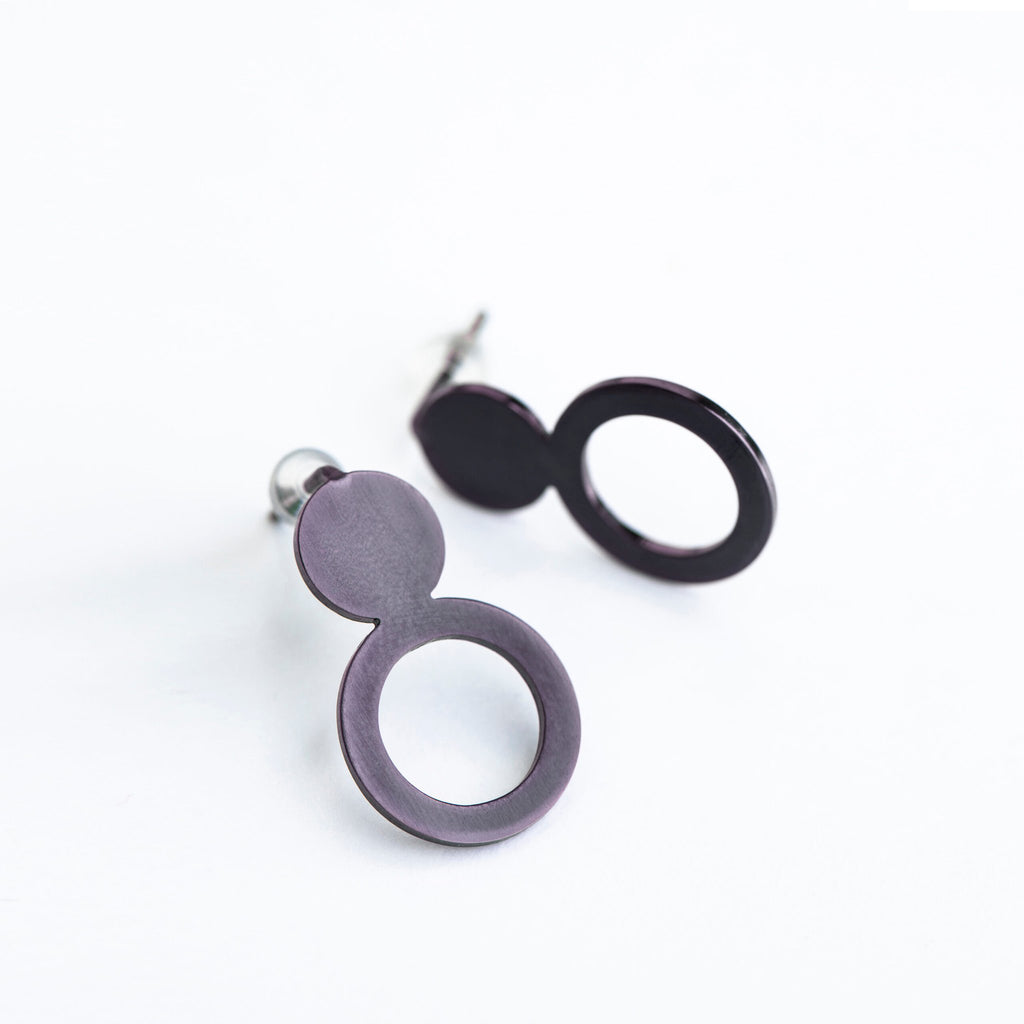 9. Studio shot of Lentsius Arc Purple earrings, highlighting upcycled industrial materials