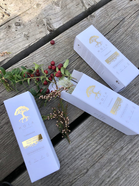 3. HOIA homespa Sacred Forest Peat Mask boxes with cranberries and greenery, emphasizing natural ingredients