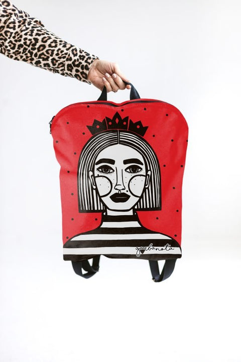 2. Garbanota red BACKPACK EGLE with Dovilė Aleksonė artwork, held by hand, studio shot