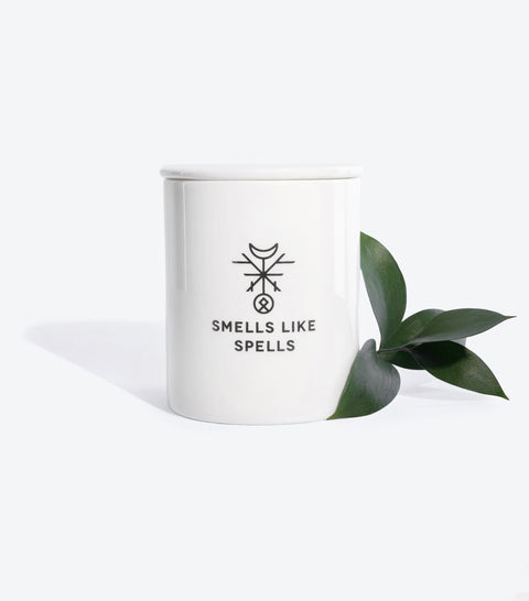 1. Smells Like Spells Scented Candle THE HERMIT in white porcelain container with green leaf accent