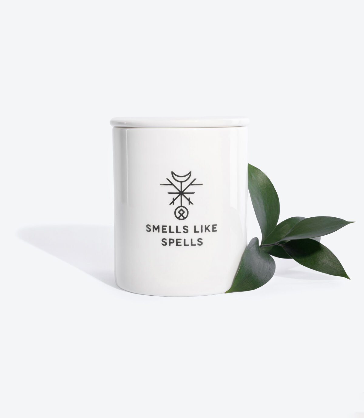 3. Smells Like Spells Scented Candle THE CHARIOT with green leaf accent, highlighting porcelain container