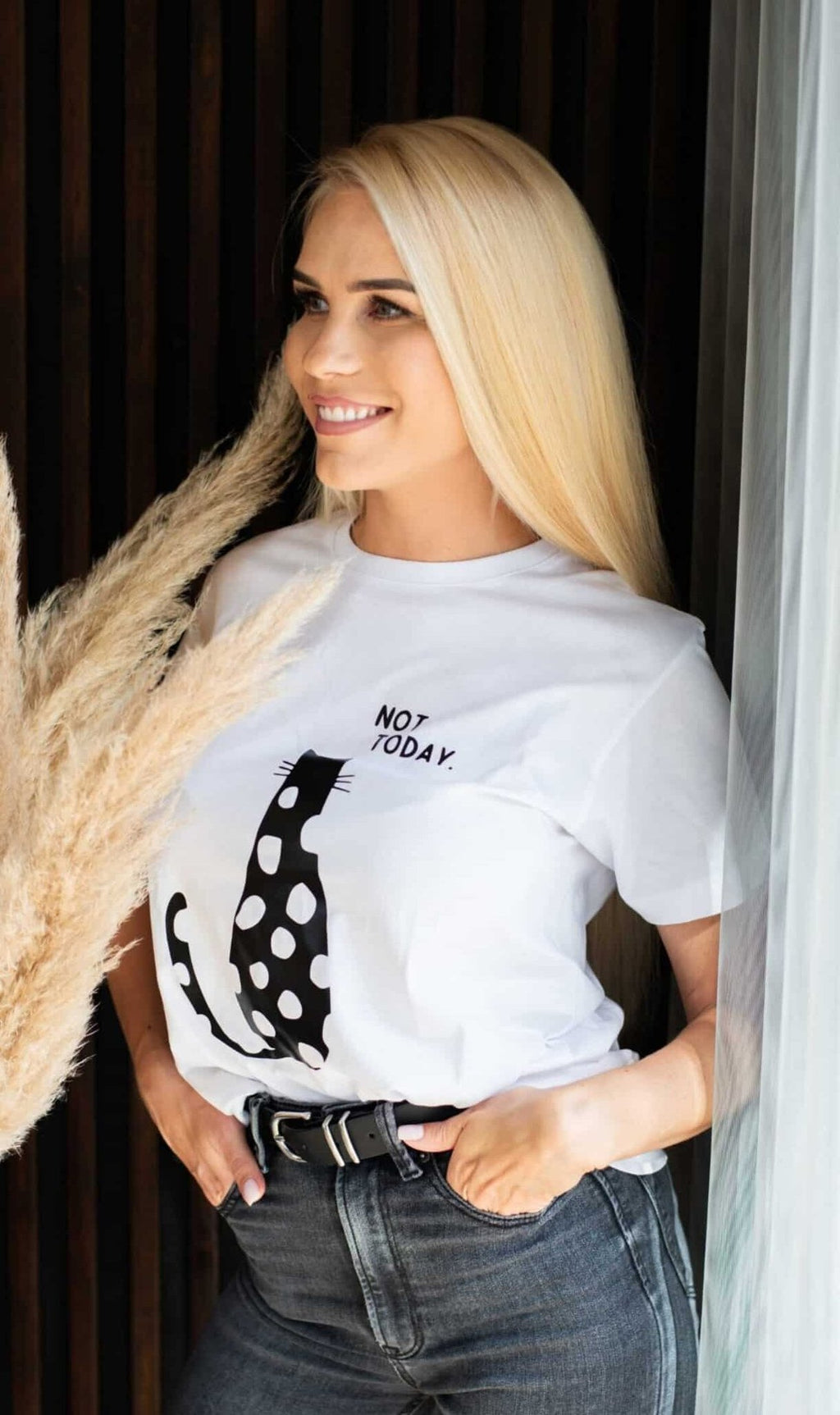 1. Women's white 'Not Today' T-shirt by Black Giraffe Brand, featuring a black polka dot cat design, worn by a model indoors