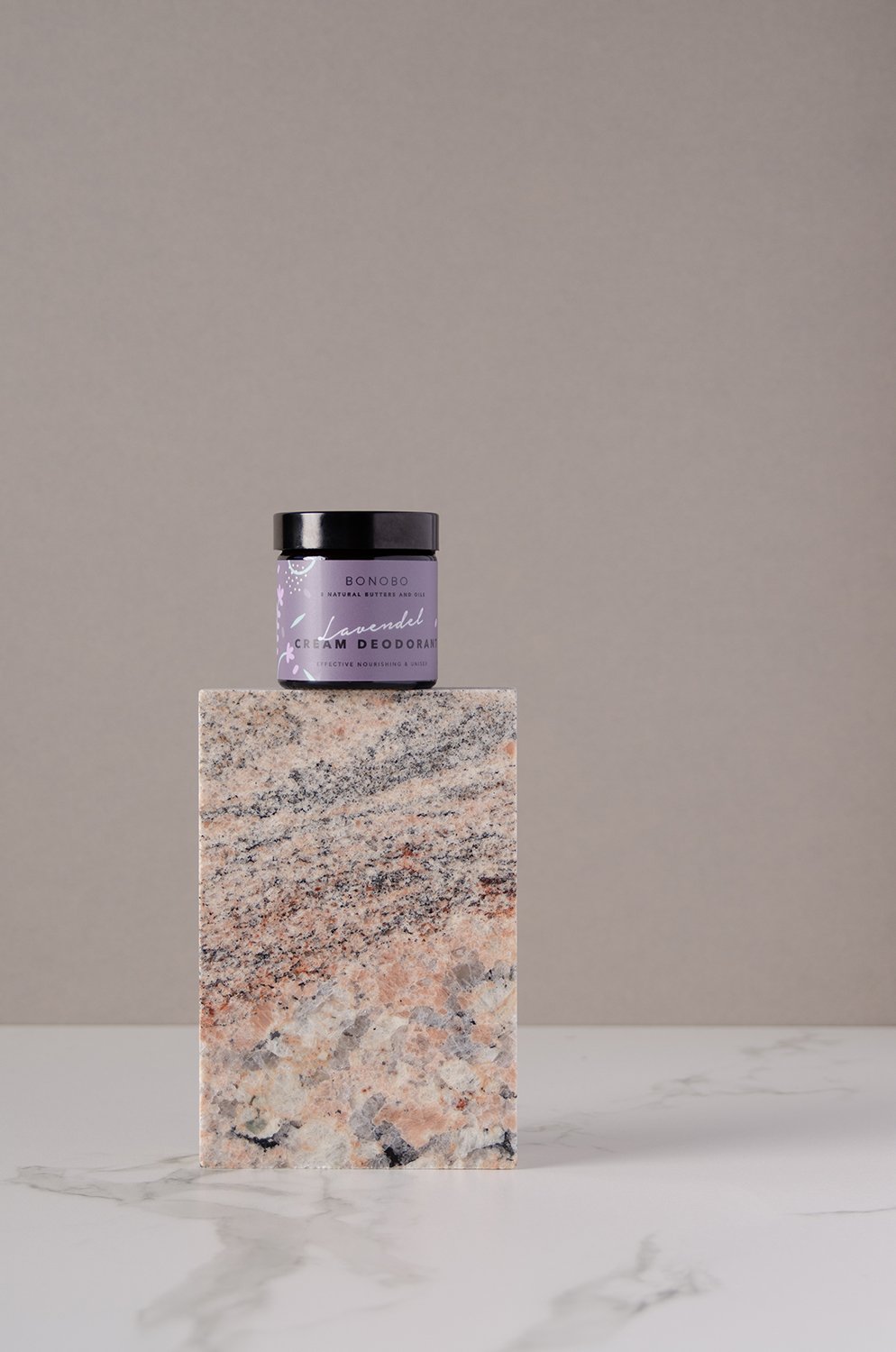 2. BONOBO Lavendel Deodorant-Cream jar displayed on a marble block in a studio setting