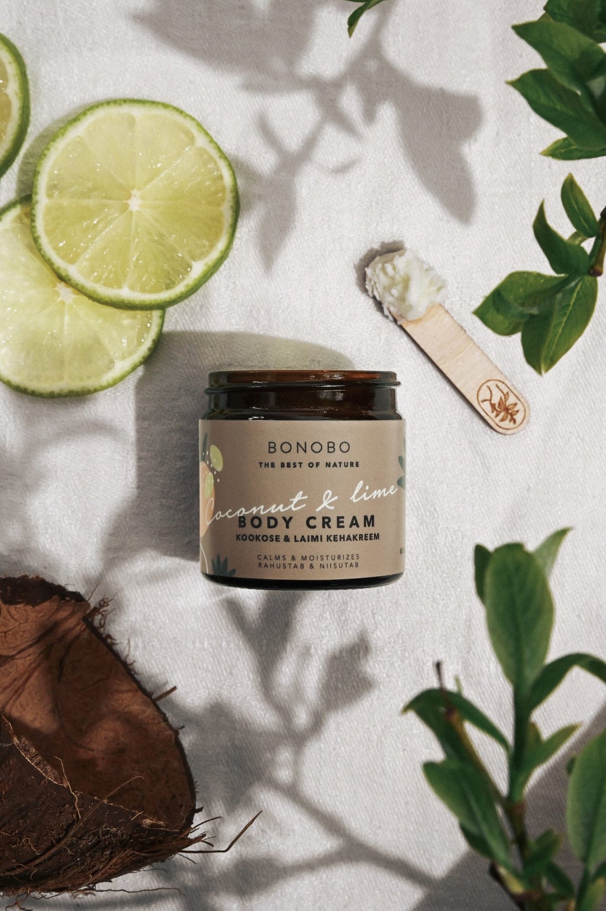 1. BONOBO Coconut and Lime Body Cream jar with lime slices and coconut, shown in a natural setting