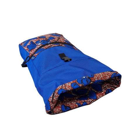 3. Flat lay of Drinbags BRIGHT CHERRY blue backpack with cherry pattern, highlighting roll-top closure