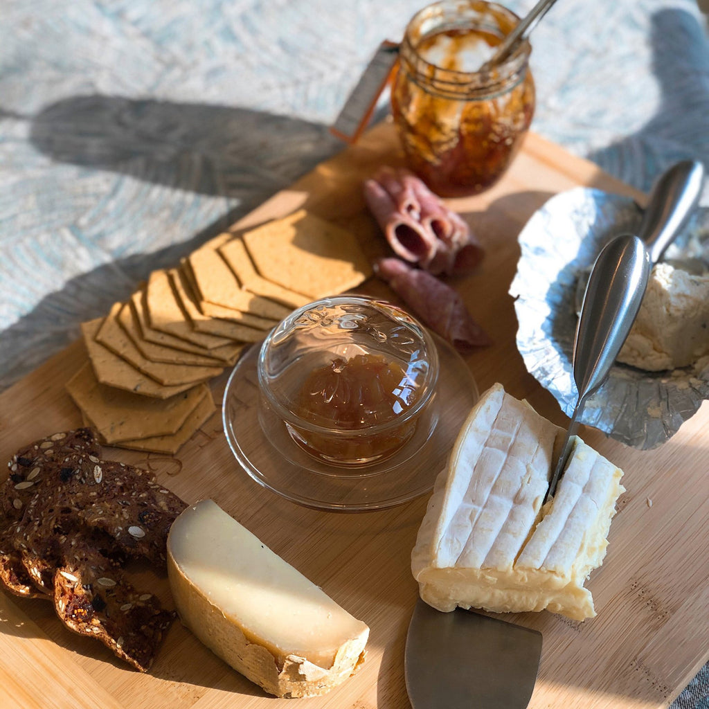 3. Bee Butter Dish on wooden board with cheese, crackers, and jam