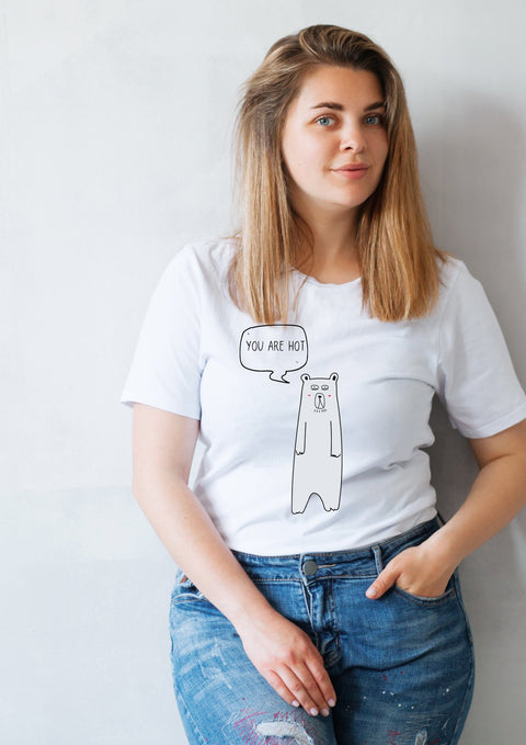 1. Women's white 'You Are Hot' T-shirt by Black Giraffe Brand, featuring a playful bear graphic, worn by a model in a casual setting