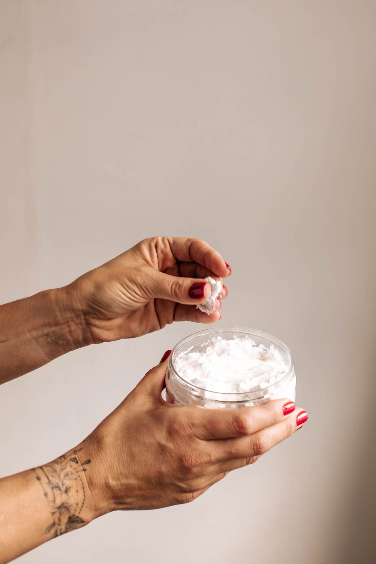 5. Woman holding 'Mom's Last Nerve' candle from Black Giraffe Body Care Gift Set, with phone in hand