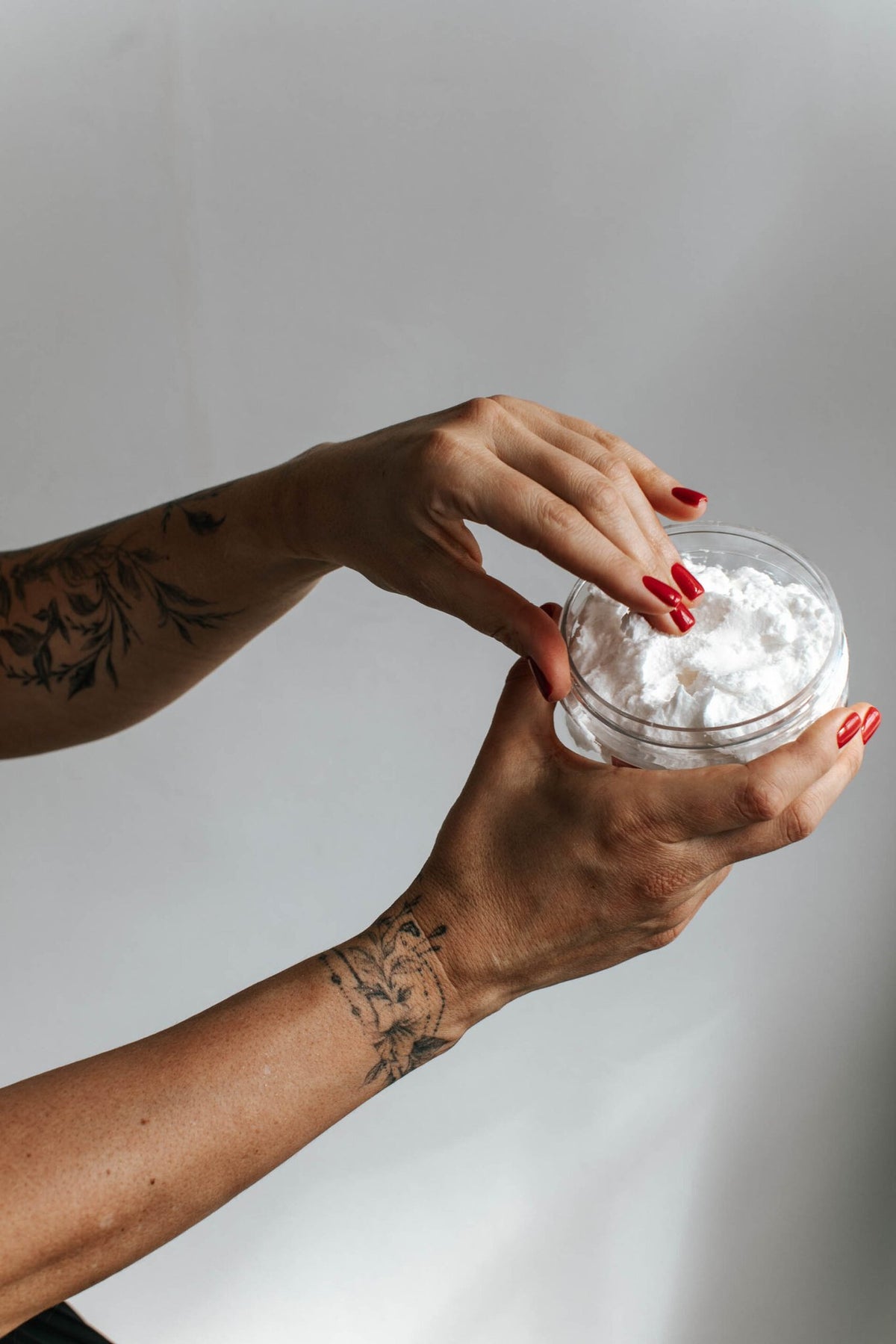 5. Close-up of Black Giraffe Brand Exfoliating Shower Cream being applied, emphasizing texture