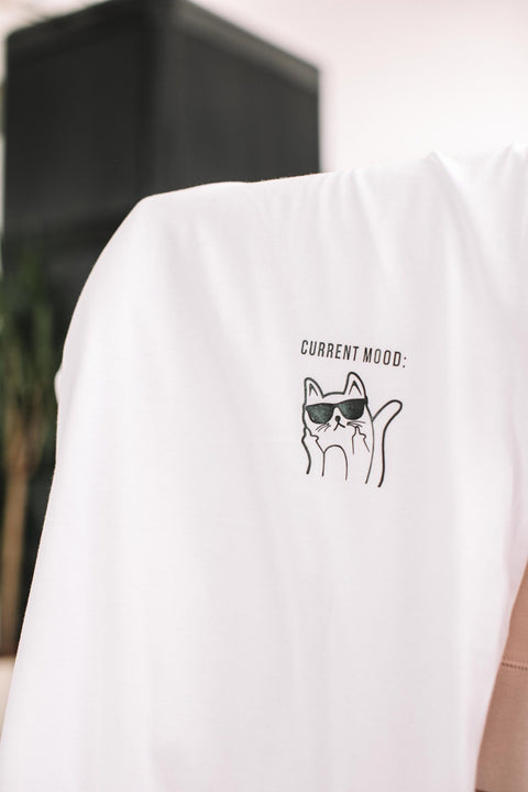 5. Close-up of kitty design on white Current Mood T-Shirt by Black Giraffe Brand, highlighting print detail