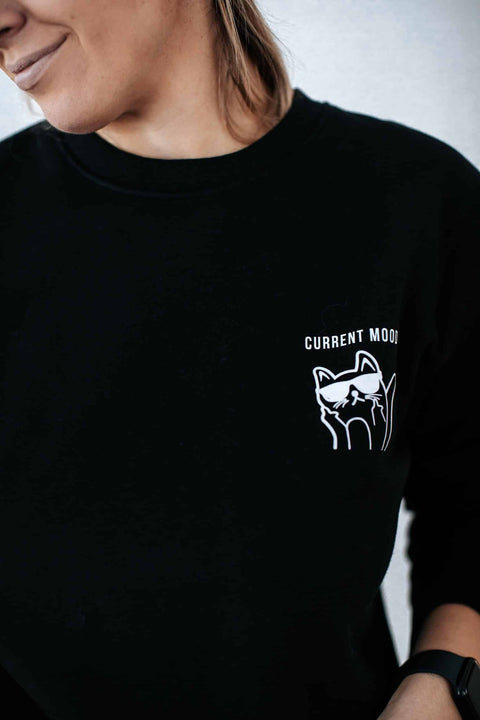 1. Women's oversized black sweatshirt with grumpy cat design by Black Giraffe Brand, worn by model
