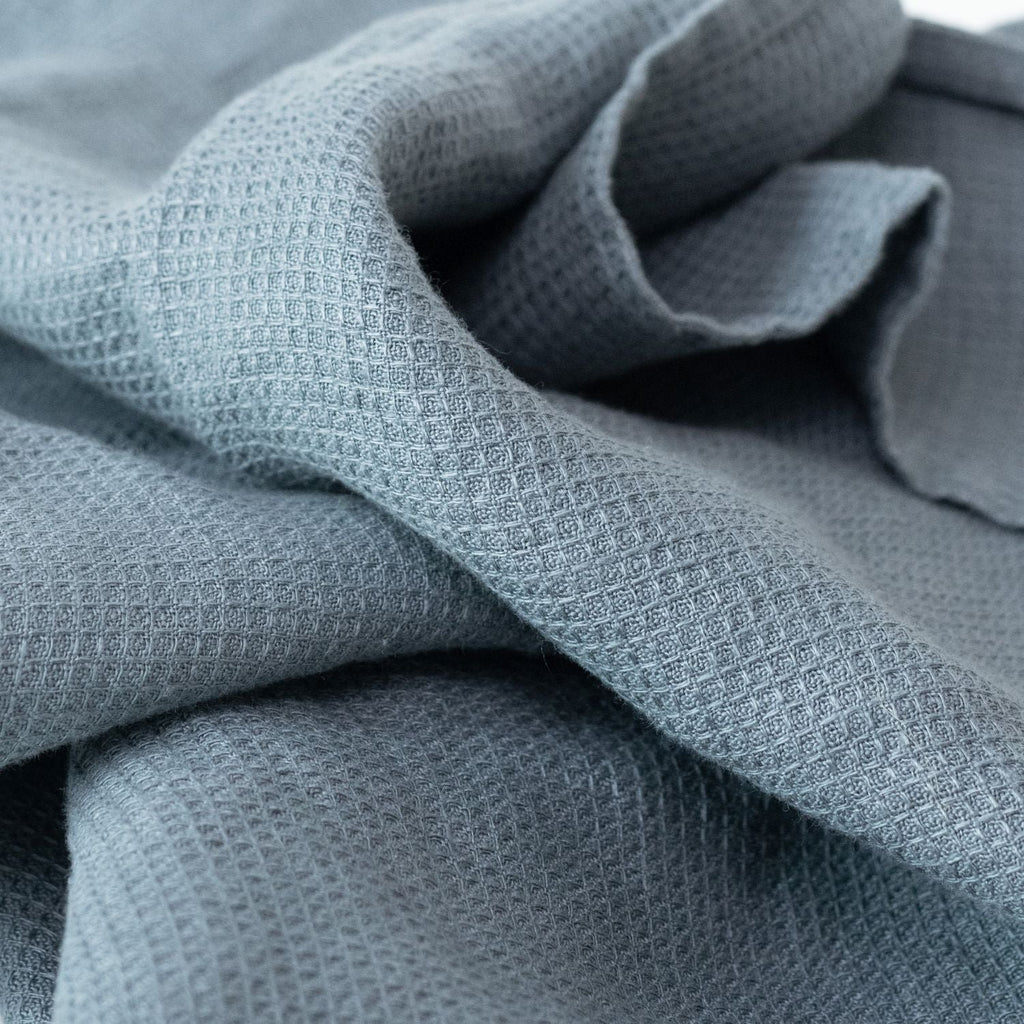 2. Close-up of blue fog waffle linen towel texture showing fine weave detail