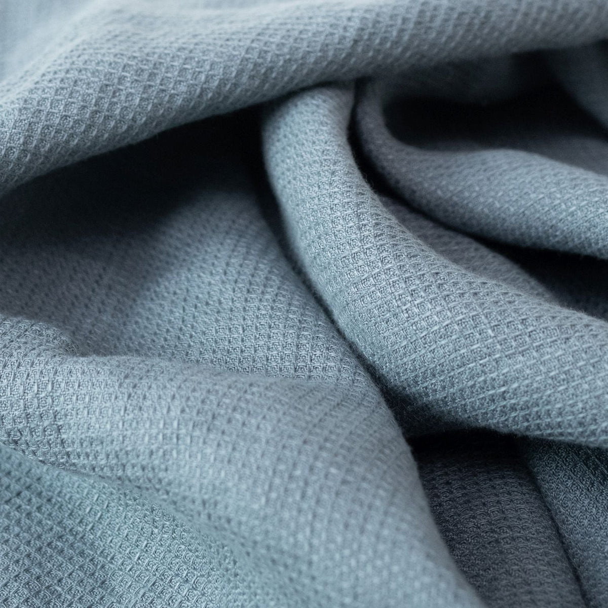 5. Close-up of blue fog waffle linen towel fabric highlighting texture and weave