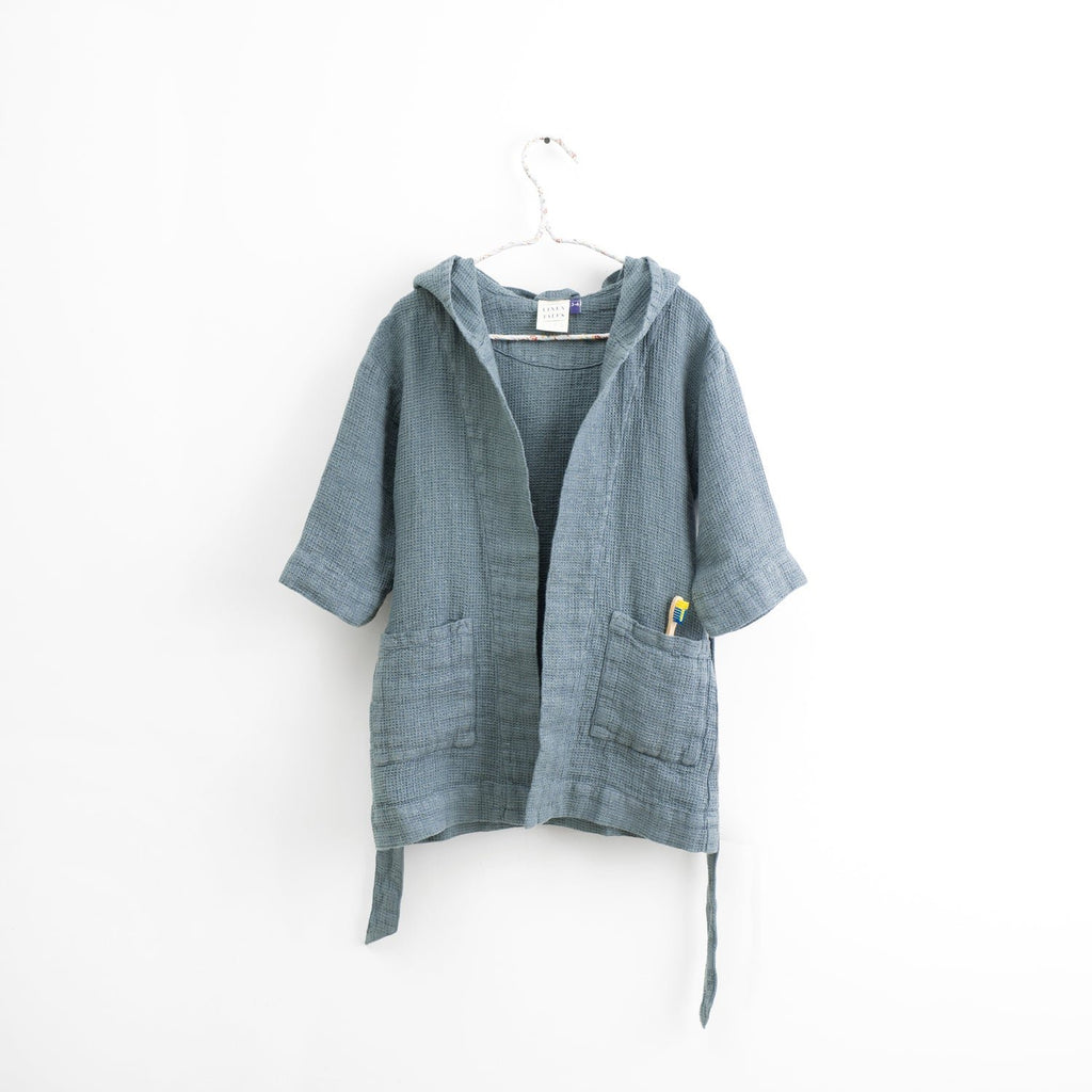 2. Kids' blue fog linen bathrobe with hood hanging on white background