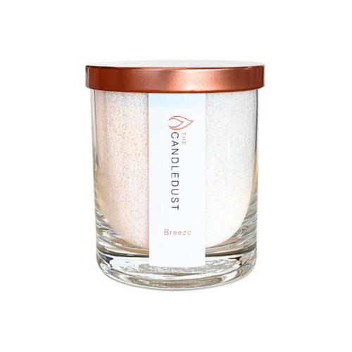 2. Studio shot of Candledust Powdered Candle in Glass - Breeze with rose gold lid, showcasing elegant design