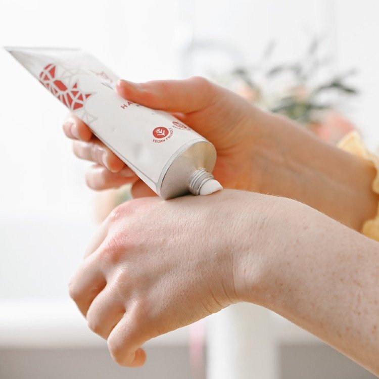 7. Close-up of Vegan Fox Nourishing Hand Cream being applied to hands, demonstrating use
