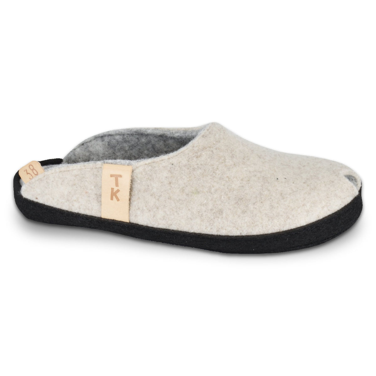 1. TOKU Brussels natural white slippers in studio, showcasing black microfibre sole and lambswool felt upper