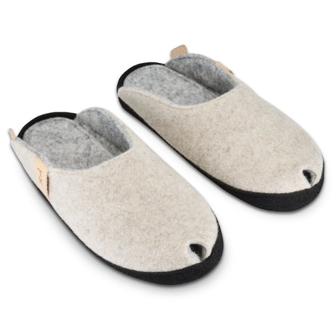 2. Pair of TOKU Brussels slippers in natural white, highlighting lambswool felt and black sole