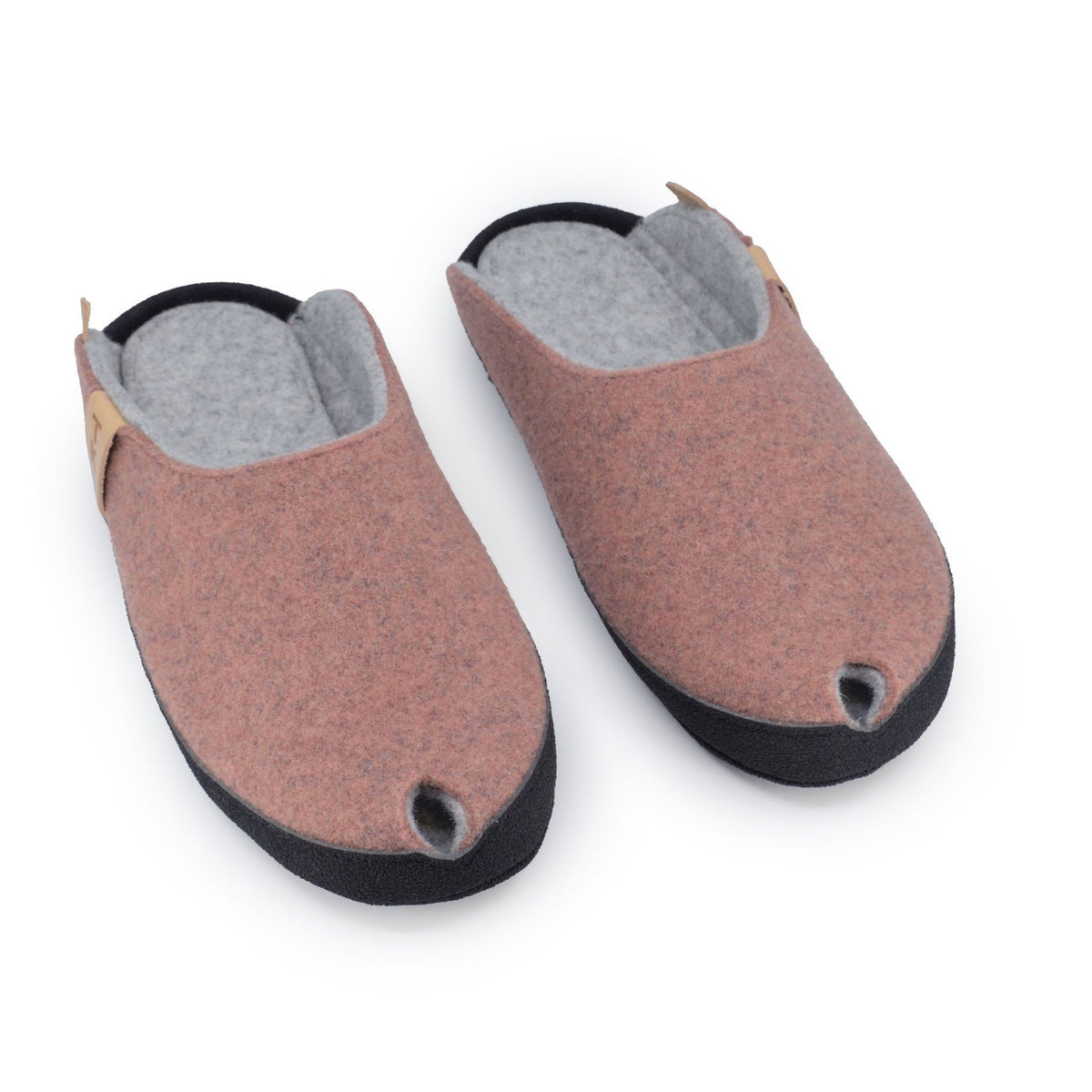 1. Women's TOKU Brussels slippers in dust pink, made from natural lambswool felt with black microfibre sole, shown in studio setting