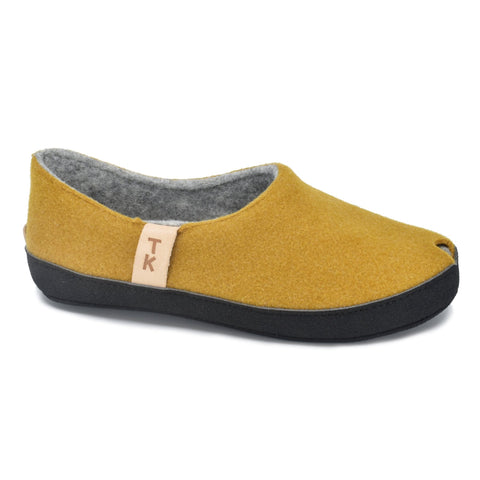 1. Studio shot of Omaking TOKU Budapest slippers in mustard yellow, featuring closed heel and toe design with peek-hole, made from natural lambswool felt