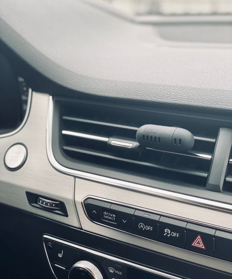 3. Candledust Champagne Rhubarb car diffuser on dashboard vent, emphasizing modern car interior integration