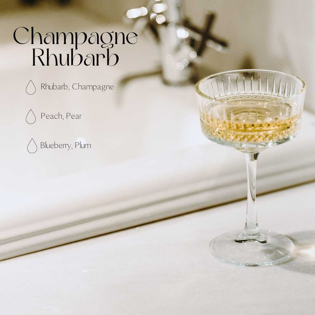 6. Lifestyle image of champagne glass with fragrance notes for Candledust Champagne Rhubarb diffuser