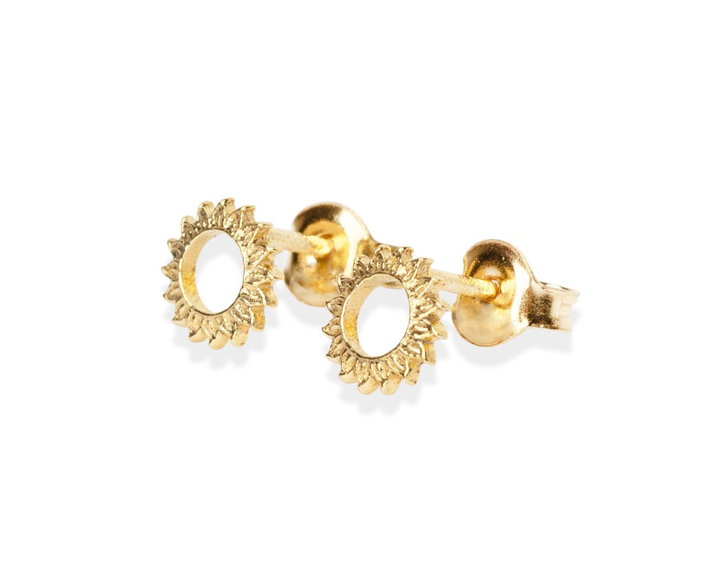 1. Gold-plated silver stud earrings by New Vintage by Kriss, featuring a sunburst design, shown in close-up