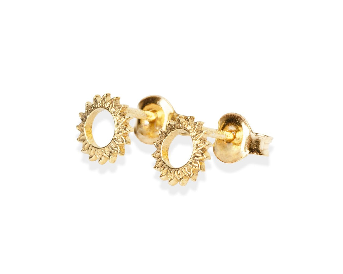 1. Gold-plated silver stud earrings by New Vintage by Kriss, featuring a sunburst design, shown in close-up
