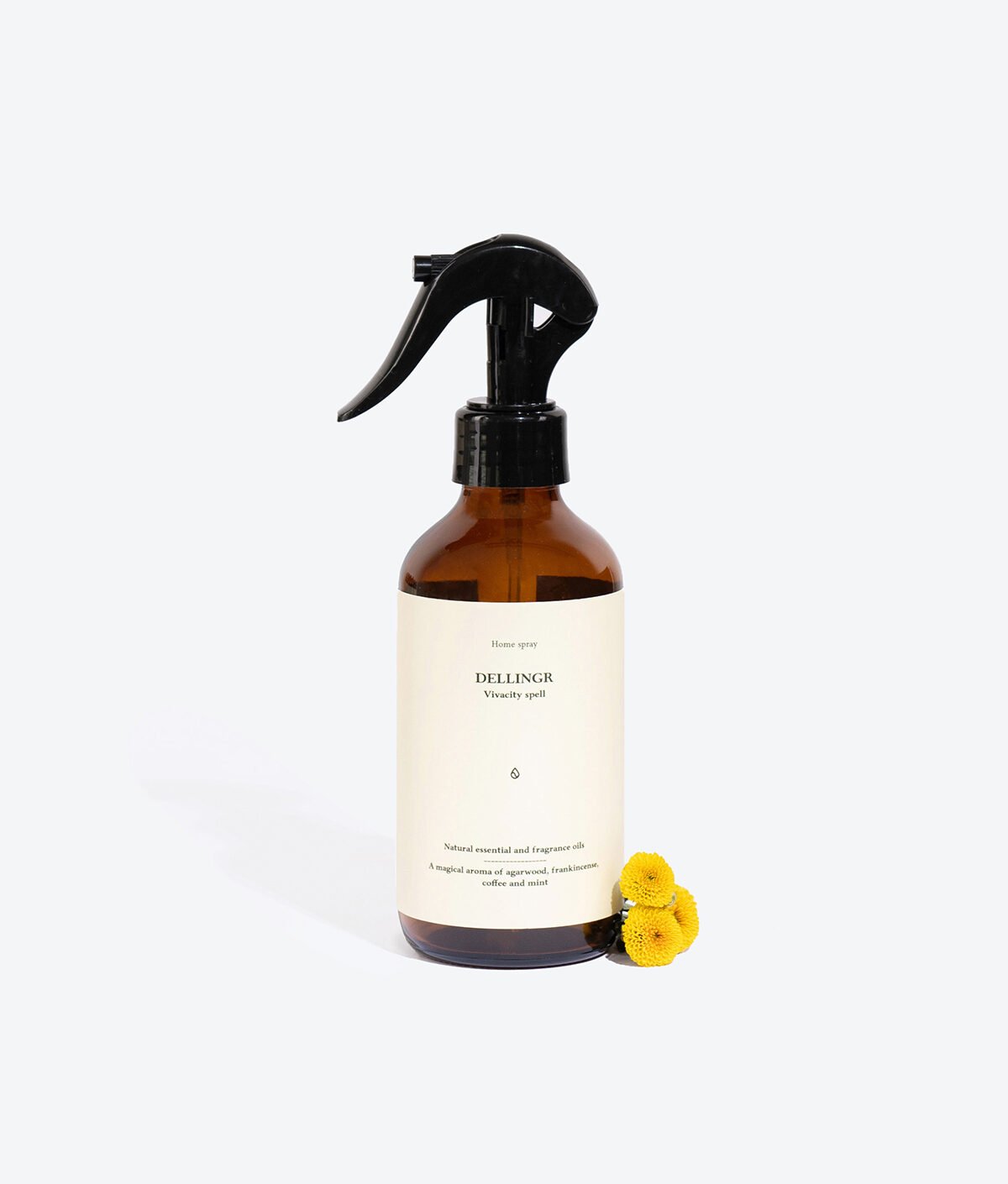 1. Smells Like Spells DELLINGR perfumed home spray in amber bottle with yellow flowers, studio setting