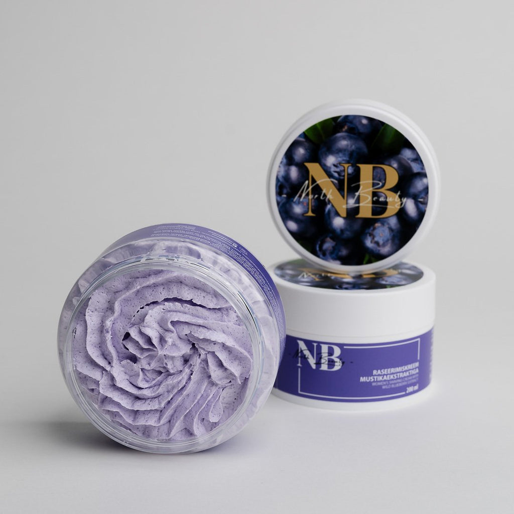 1. North Beauty Blueberry Extract Body Care Kit featuring whipped body scrub and shaving cream in studio setting