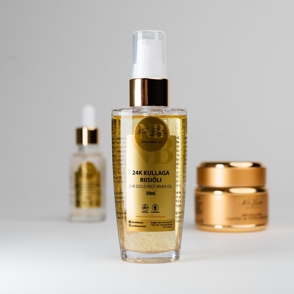 3. North Beauty 24K Gold rice oil bottle with face cream and facial serum in background, studio shot