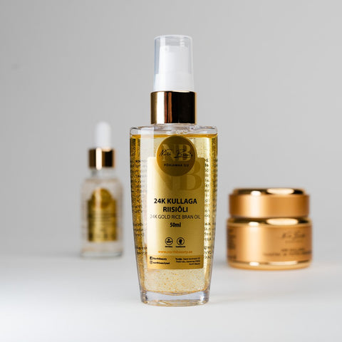 1. North Beauty 24K Gold Rice Oil 50ml in lifestyle setting with additional skincare products