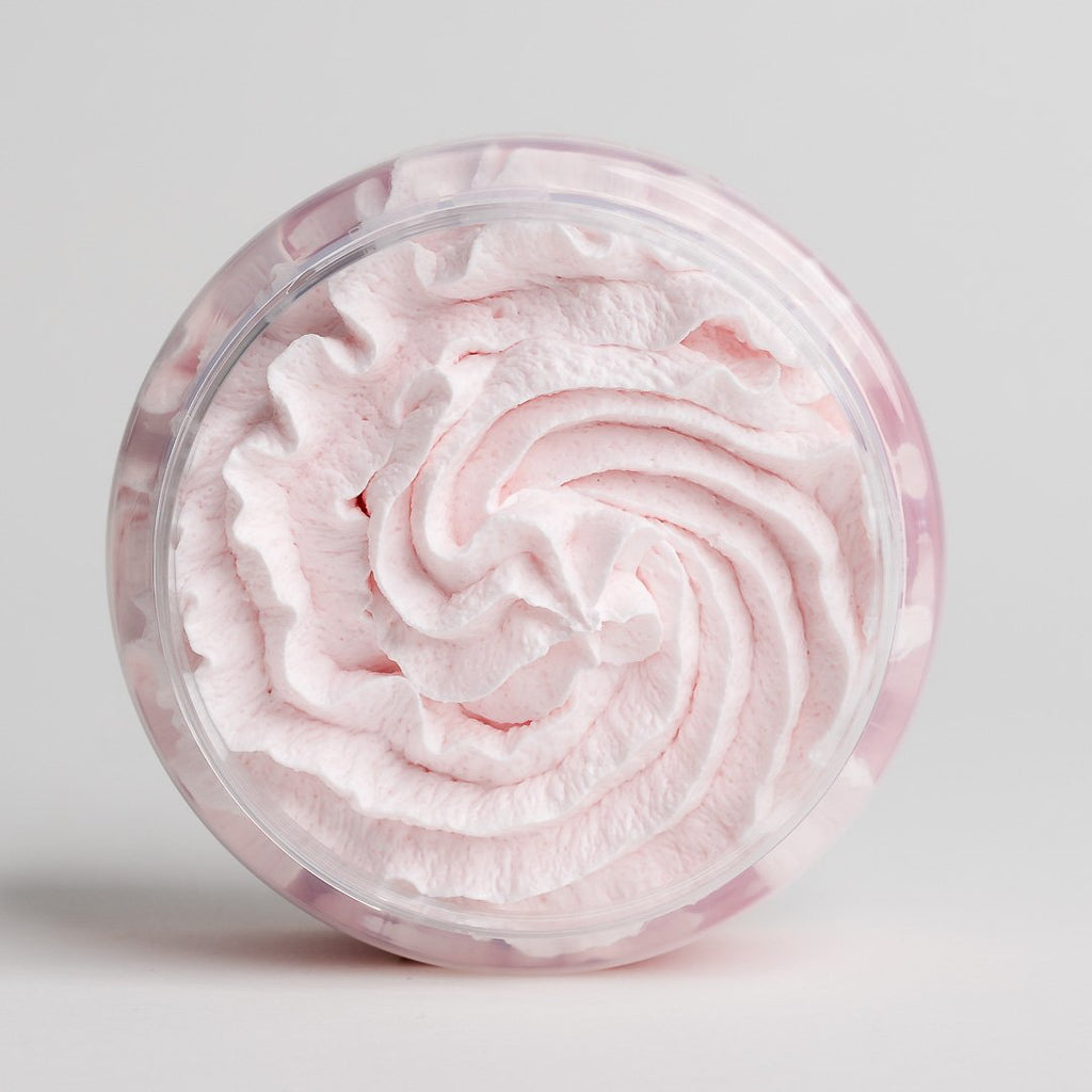 1. Top view of North Beauty Whipped Body Scrub with Cranberry, showcasing its creamy texture in a clear jar