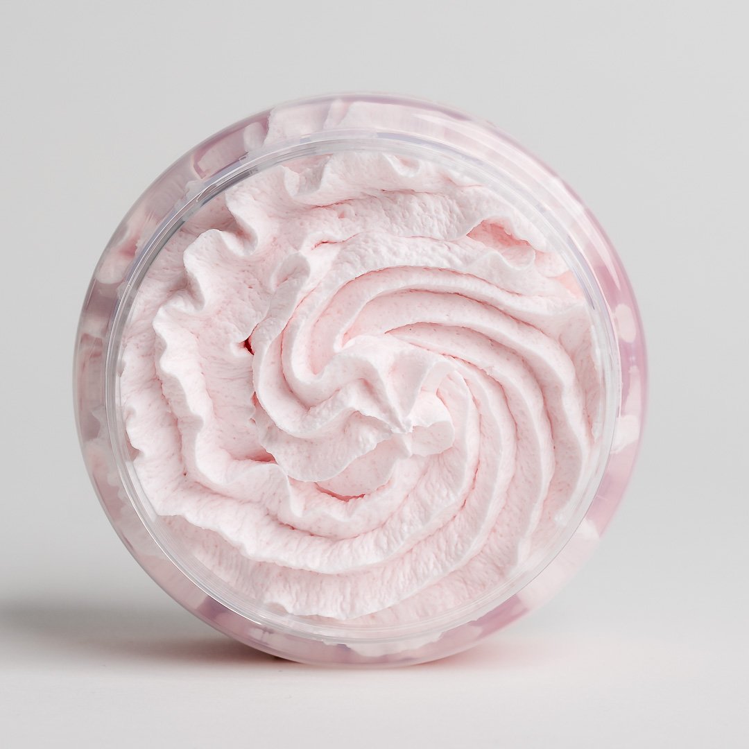 1. Top view of North Beauty Whipped Body Scrub with Cranberry, showcasing its creamy texture in a clear jar