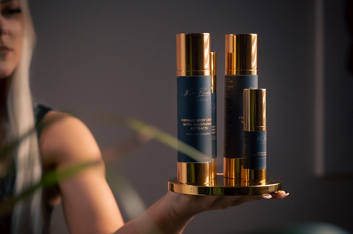 1. North Beauty Firming Body Cream with Hyaluronic Acid and Flower Extracts, held by a woman, showcasing luxurious packaging